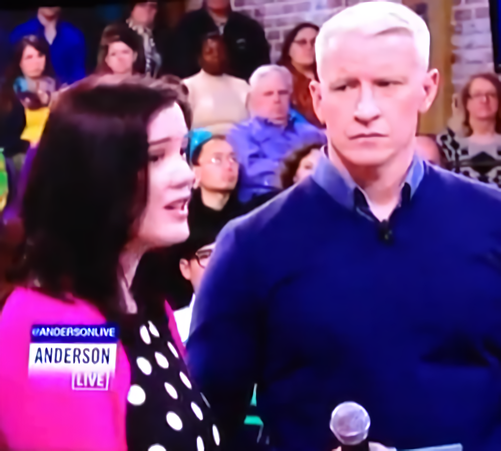 Still shot of Christina standing next to Anderson Cooper on Anderson Live