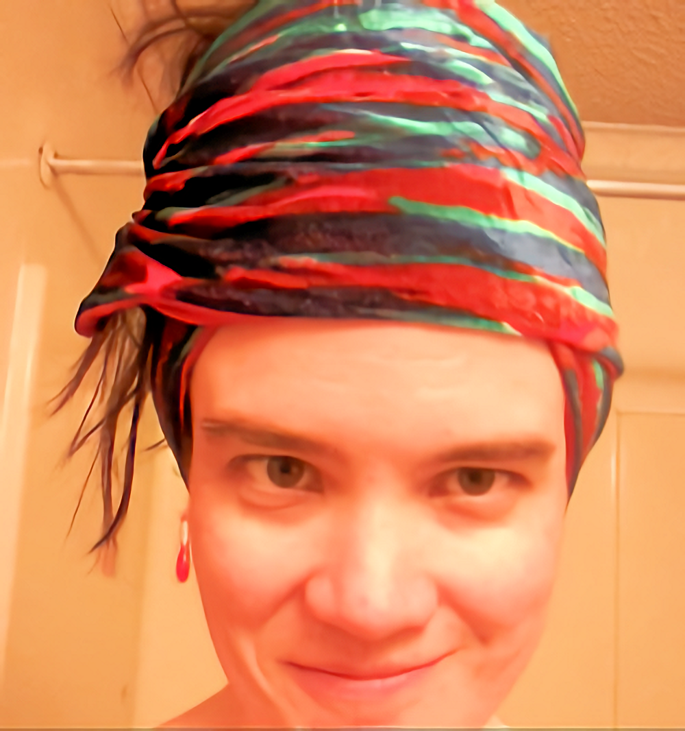 Selfie showing my hair put up in a colorful scarf